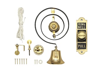 May include: A vintage brass doorbell kit with a bell, pulley system, and a wall-mounted plate. The plate reads "RING BELL PULL". Includes mounting hardware and a length of white rope. The bell is suspended from a black metal spiral.