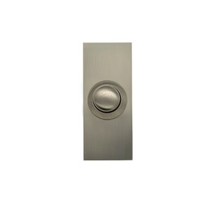May include: A silver doorbell button with a round, slightly raised button.