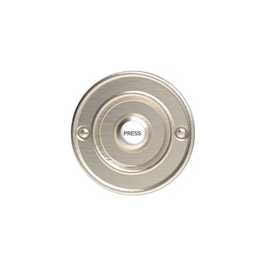 May include: A round, silver doorbell button with a concentric circle design. The button has a white centre with the word "PRESS" printed on it.