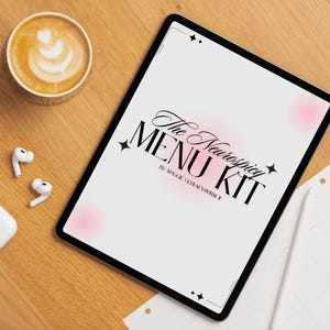 May include: A digital tablet displaying "The Neurospicy MENU KIT" text, with a coffee cup, wireless earbuds, and a charging case on a wooden surface. The coffee has latte art. The tablet has a black border.