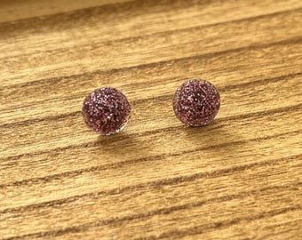 Pendientes circulares con purpurina morada