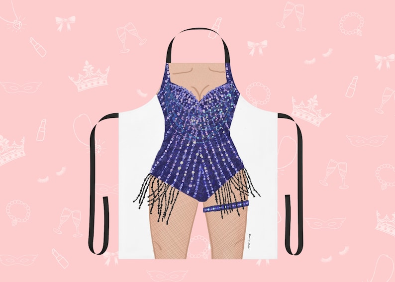 May include: A white apron with a black adjustable strap and a colorful sequined design of a woman's body. The design features a purple and blue sequined bodice with black fringe and a black garter belt.
