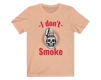 May include: A peach colored t-shirt with a skull graphic and the text "I don't- Smoke" in red.