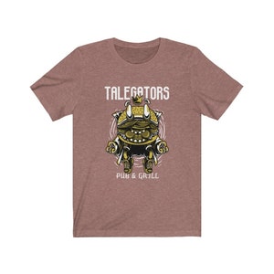 May include: A heather brown t-shirt with a cartoon burger wearing a crown and the text "Talegators Pub & Grill".