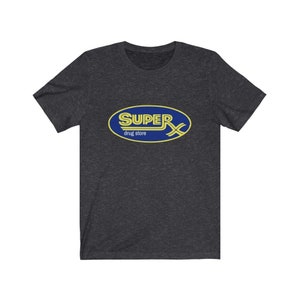 May include: A dark heather grey t-shirt with a blue oval logo that says "SUPER drug store" in yellow letters.