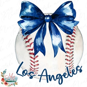 May include: A white baseball with red stitching and a blue bow on top. The words "Los Angeles" are written in blue below the baseball.