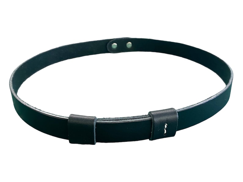 May include: A black leather belt with a simple buckle and two adjustable holes. The belt is made of a thick, durable leather and has a smooth finish.