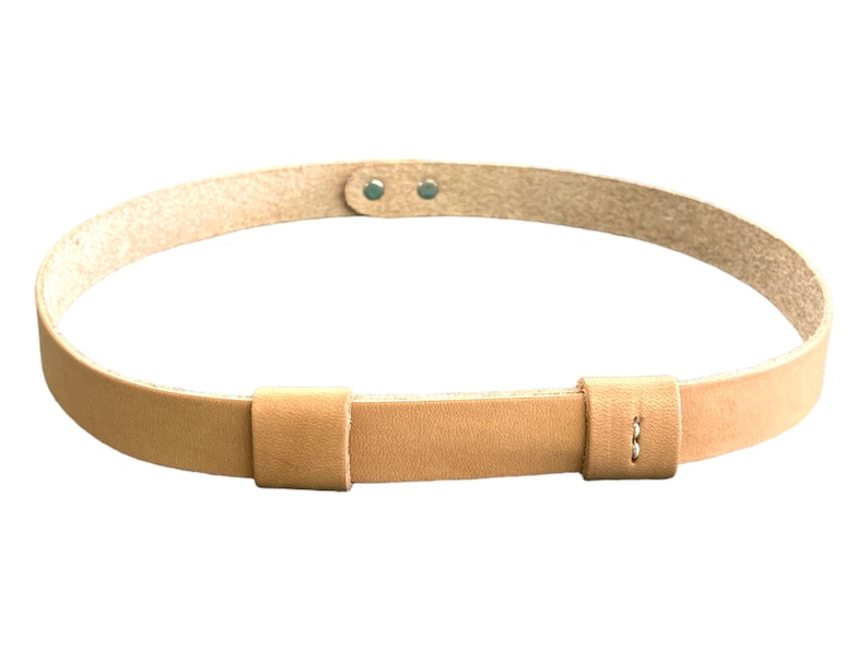May include: A light brown leather belt with two adjustable straps and two metal rivets.