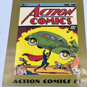 May include: A vintage comic book cover featuring Superman lifting a car. The cover is yellow with black text that reads "HISTORICAL COVER", "ACTION COMICS", "No. 1", "JUNE, 1938", and "10c".