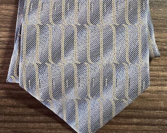 Corbata de seda vintage hecha en Canadá. Ondas brillantes azules y amarillas.