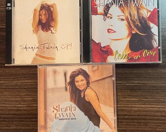 CDs originales de Shaina Twin: Come on Over (1997), Up (2002) y Greatest Hits (2004)
