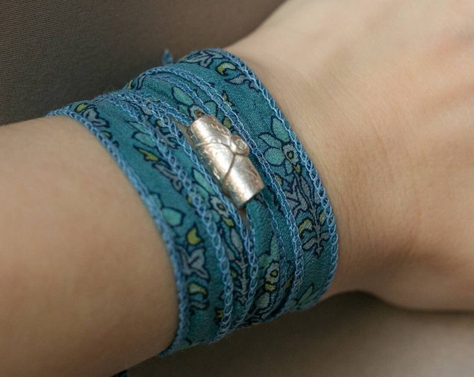Artisan silver charm silk bracelet