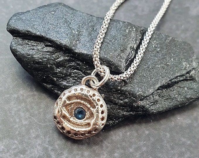 Evil Eye Silver pendant with blue Sapphire