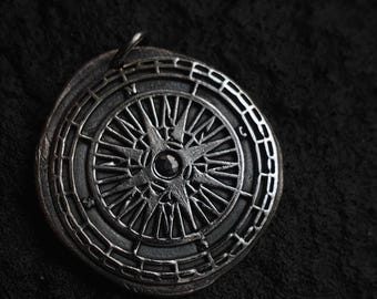 Compass pendant with blue Sapphire