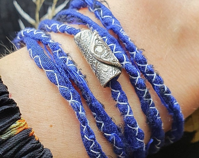 Bohemian wraparound bracelet with an artisan silver charm