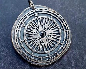 Compass pendant with blue Sapphire
