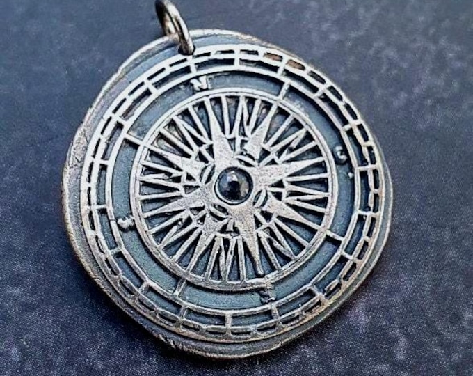 Compass pendant with blue Sapphire