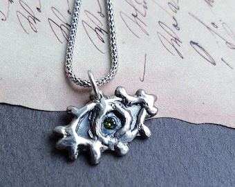 Evil Eye pendant with green Cubic Zirconia