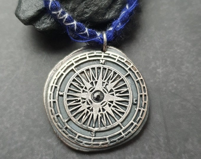 Compass pendant with blue Sapphire