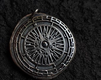 Compass pendant with blue Sapphire