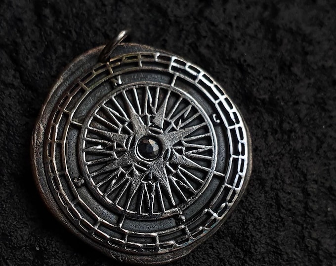 Compass pendant with blue Sapphire