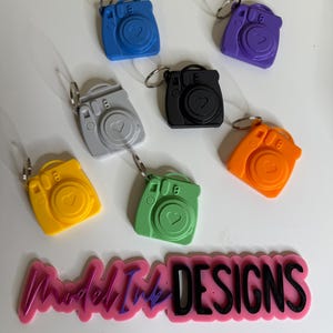 Custom Mini Camera Keychains with photo holder. Pull out personalized picture. Gifts. Party Favors. Keepsakes for special occasions. Colors.