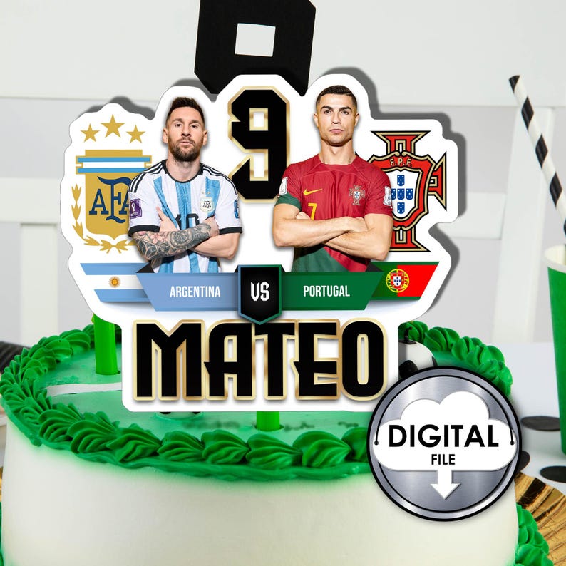 May include: A cake topper featuring Lionel Messi and Cristiano Ronaldo, with the text "Argentina vs Portugal" and "Mateo". The topper is decorated with the flags of Argentina and Portugal.