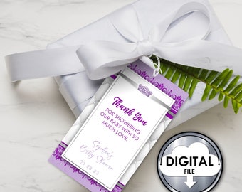 May include: Purple and silver thank you tag with a crown design and the text "Thank You for showering our baby with so much love. Sophii's Baby Shower 03.28.23"