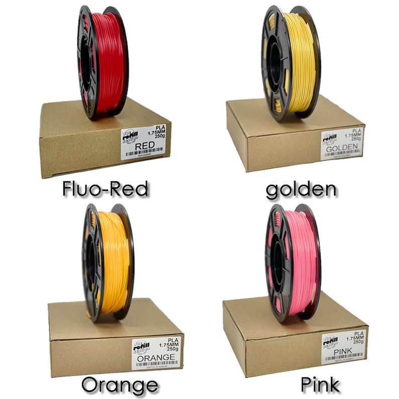 Peut inclure: Quatre bobines de filament PLA de 1,75 mm en rouge, orange, jaune et rose. Chaque bobine est &eacute;tiquet&eacute;e avec la couleur et emball&eacute;e dans une bo&icirc;te en carton marron.