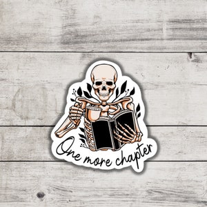 May include: A skeleton holding a book and a cup of coffee with the text "One more chapter" on a white background.