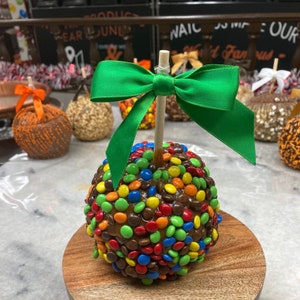 Gourmet Caramel Apples with M&M's with made from scratch caramel from locally grown jumbo tart Indiana apples.