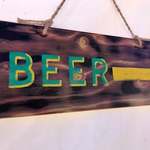 Hand painted burnt ‘Beer’ pointing sign