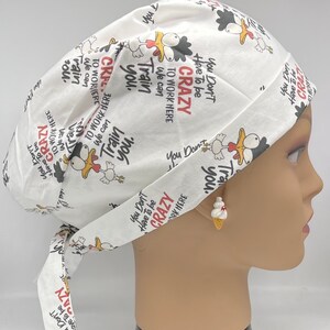 May include: White scrub hat with a repeating pattern of chickens and the text "You Don't Have To Be Crazy To Work Here We Can Train You".