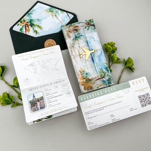 May include: Wedding invitation suite featuring a passport, boarding pass, and envelope with tropical palm tree designs. The passport-style invitation includes a photo and details. The boarding pass and envelope also have tropical designs.