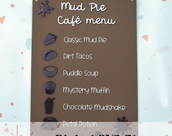 May include: A brown wooden sign with white text that reads "Mud Pie Cafe menu". The sign lists a menu of items including "Classic Mud Pie", "Dirt Tacos", "Puddle Soup", "Mystery Muffin", "Chocolate Mudshake", and "Petal Potion".