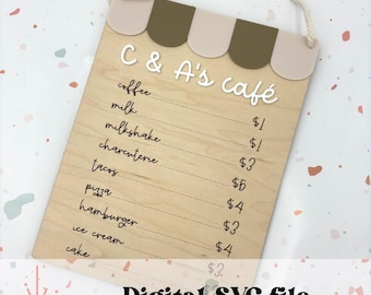 May include: A wooden sign with a cafe menu. The sign is painted brown and has a white awning with green stripes. The menu includes items like coffee, milk, milkshake, charcuterie, tacos, pizza, hamburger, ice cream, and cake. The prices are listed next to each item.