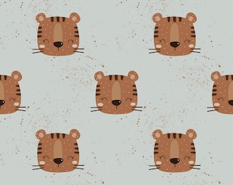 May include: A seamless pattern featuring brown tiger faces with closed eyes and a light blue background with brown speckles.