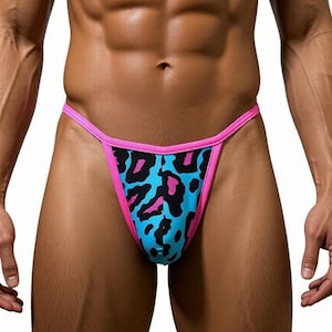 May include: A blue thong with a pink trim and a leopard print pattern in black and pink. The swimwear is designed with a low-rise waist and a string-style back.