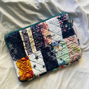 laptop cover, case cover for macbook air, cover for hp laptop, laptop sleeves all sizes, cute laptop sleeves, quilted laptop cover, puffy laptop sleeve, laptop sleeve 13 inch macbook air, laptop sleeve, laptop sleeve custom size, laptop cover 15 inch, An eco-friendly laptop sleeve showcasing a mix of vibrant, multicolor solid patchwork fabric pieces, creating a bold and eye-catching design. The quilted, puffy construction ensures your laptop is well-protected.