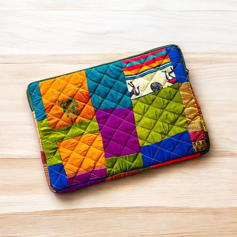 laptop cover, case cover for macbook air, cover for hp laptop, laptop sleeves all sizes, cute laptop sleeves, quilted laptop cover, puffy laptop sleeve, laptop sleeve 13 inch macbook air, laptop sleeve, laptop sleeve custom size, laptop cover 15 inch, An eco-friendly laptop sleeve showcasing a mix of vibrant, multicolor solid patchwork fabric pieces, creating a bold and eye-catching design. The quilted, puffy construction ensures your laptop is well-protected.
