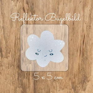 May include: A white iron-on patch featuring a cute cartoon cloud with a smiling face and blue eyes. The patch is 5 cm by 5 cm and says "Reflektor Bügelbild" in German.