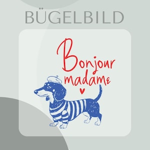 Puede incluir: Un perro salchicha azul con boina y camisa a rayas, con el texto "Bonjour madame" en escritura roja. Un pequeño corazón rojo está debajo del texto. La imagen está en un cuadrado blanco con el texto alemán "BÜGELBILD" en la parte superior.