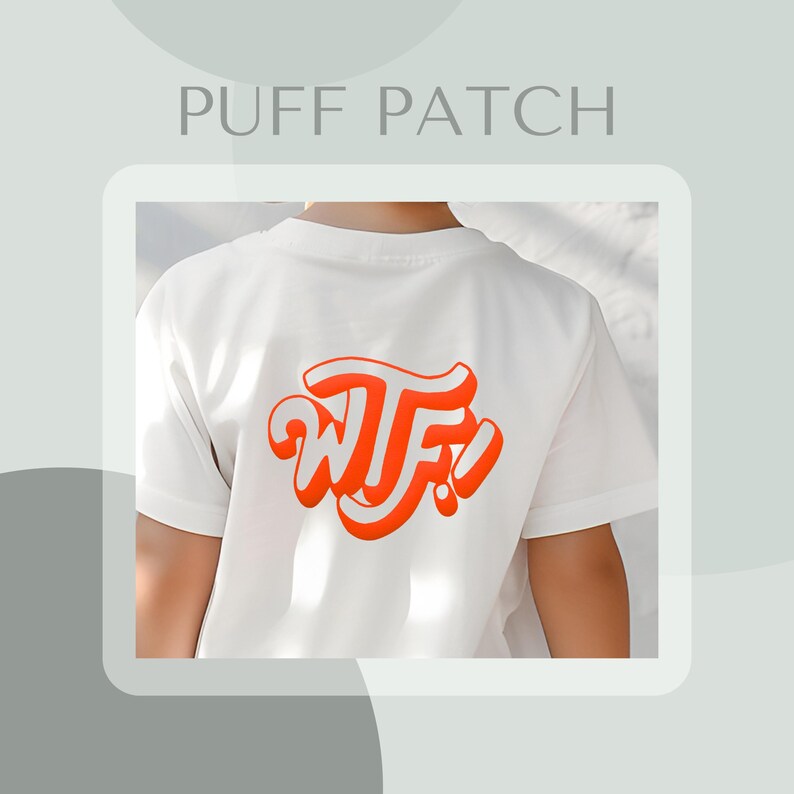 May include: White t-shirt with a red "WTF!" puff patch on the back.