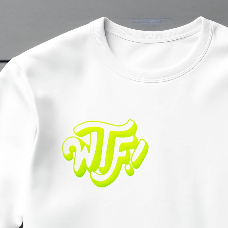 May include: White t-shirt with a neon green graphic that says "WTF!" in a stylized font.