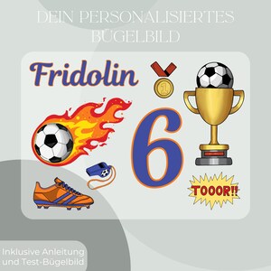May include: A soccer-themed graphic with the name "Fridolin" in blue script, a soccer ball engulfed in flames, a number 6, a trophy, a whistle, a soccer cleat, a medal, and the word "TOOOOR!!".