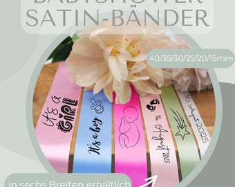 Personalized satin ribbon for baby showers, available in various colors, widths, and text. Printable with names.
