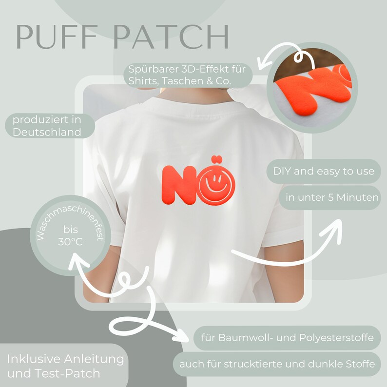 Może przedstawiać: Biała koszulka z czerwoną naszywką "N&Ouml;" z uśmiechniętą buzią. Obraz zawiera niemiecki tekst, taki jak "PUFF PATCH", "produziert in Deutschland" i "DIY and easy to use in unter 5 Minuten". Naszywkę można prać w temperaturze do 30&deg;C.