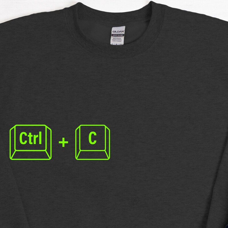 Może przedstawiać: Czarna bluza z neonowo-zieloną grafiką skr&oacute;t&oacute;w klawiaturowych "Ctrl + C". Projekt przedstawia słowo "Ctrl" i literę "C" w obrysowanych kwadratach, ze znakiem plus pośrodku. Bluza wykonana jest z miękkiego materiału.