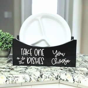 May include: A set of three ceramic mugs with a speckled, matte finish. The mugs are in shades of cream, light gray, and dark gray. Each mug has a simple, minimalist design, perfect for coffee or tea.