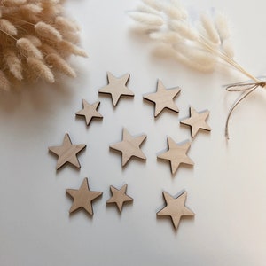 Wooden stars in different sizes 10 pieces